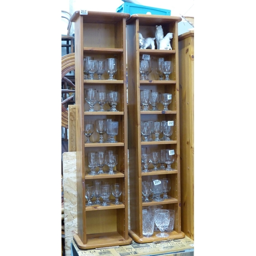 217 - A pair of pine slimline bookcases.