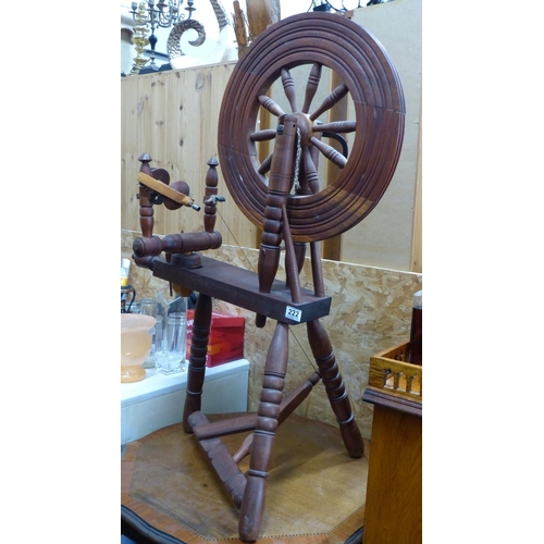 222 - An antique style spinning wheel.