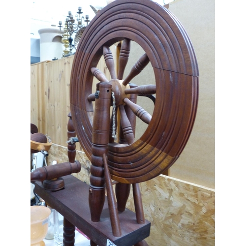 222 - An antique style spinning wheel.