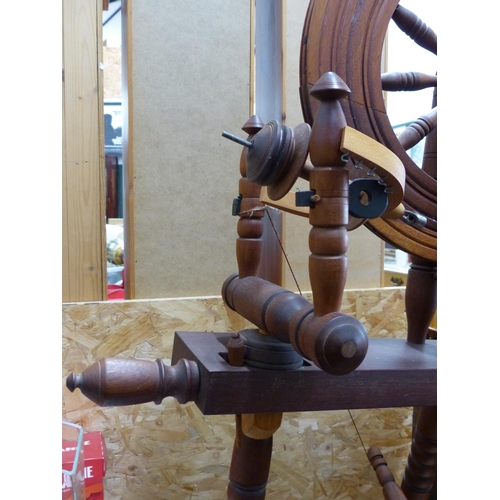 222 - An antique style spinning wheel.