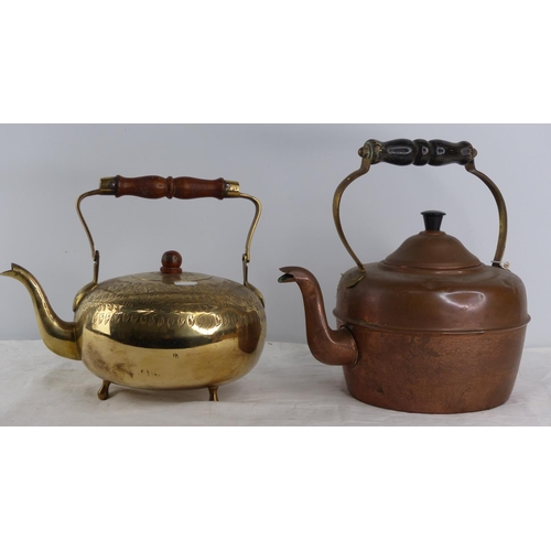 231 - An antique copper kettle and a vintage brass teapot.