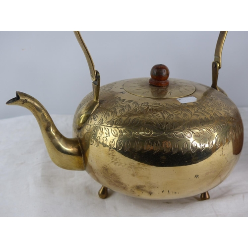 231 - An antique copper kettle and a vintage brass teapot.