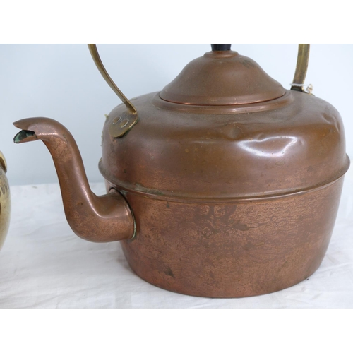 231 - An antique copper kettle and a vintage brass teapot.