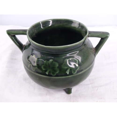 263 - An Irish porcelain three legged cauldron with shamrock detail.