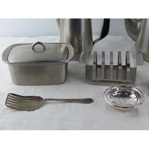 264 - A vintage stainless steel tea and coffee set including toast rack and butter dish and lots more.