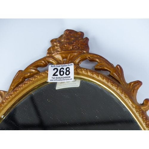 268 - An antique metal framed wall mirror 65cm .