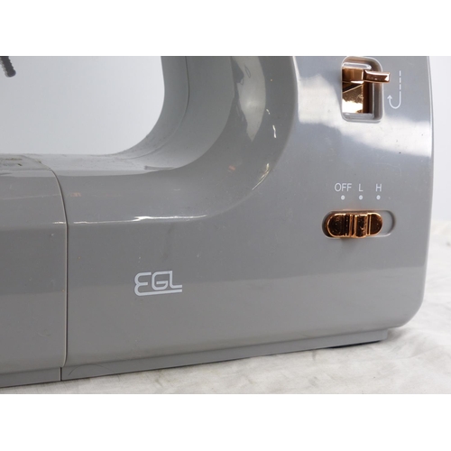 270 - A EGL sewing machine, instruction manual and more.