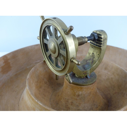 281 - A wooden serving bowl with a brass ships wheel nutcracker.