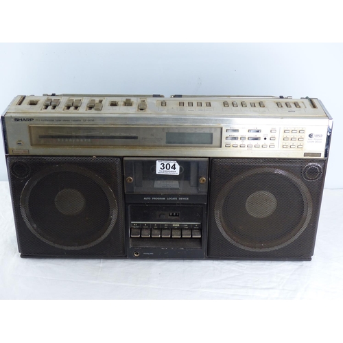 304 - A vintage Sharp GF9595H boom box/ stereo (lacking hand & power cable).