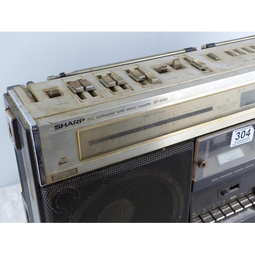 304 - A vintage Sharp GF9595H boom box/ stereo (lacking hand & power cable).