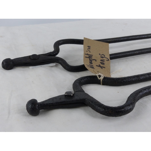 330 - 2 pair of antique wrought iron fire tongs.