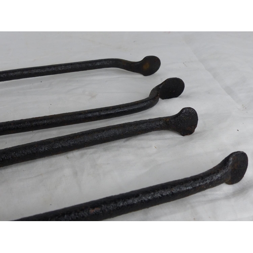 330 - 2 pair of antique wrought iron fire tongs.