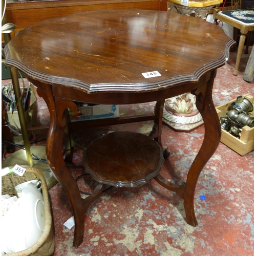 348 - An antique mahogany centre table with undershelf.