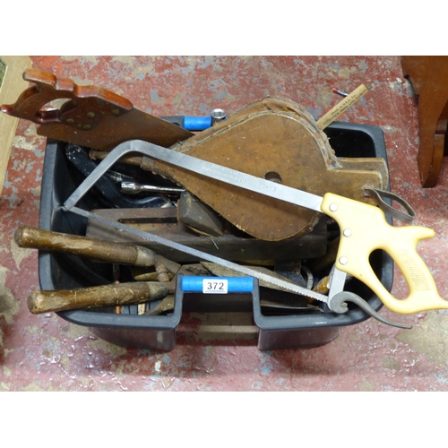 372 - A large lot of assorted tools a Broderick Brothers Ltd, Dublin butcher saw, fire bellows and more.