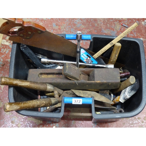 372 - A large lot of assorted tools a Broderick Brothers Ltd, Dublin butcher saw, fire bellows and more.