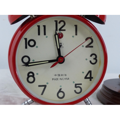 383 - A Leonard Collection 'Hen Pheasant' ornament and an alarm clock.