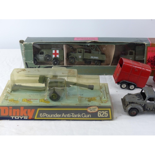 385 - A large collection of toy vehicles to include a Timpo Toys removal lorry, a cased Military Police ve... 