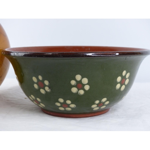 397 - A terracotta glazed bowl and a coloured glass vase.