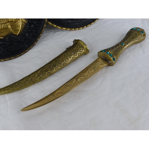 405 - A pair of vintage brass plaques and an ornamental brass dagger.