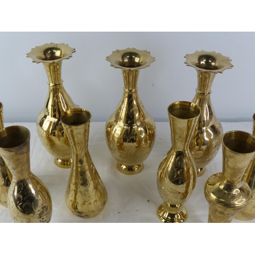 412 - A large assortment of vintage brass vases.