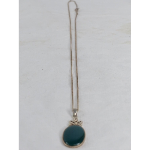 483 - A Sterling silver chain and pendant.