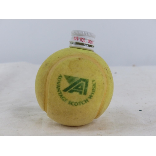 499 - An unusual Advantage Scotch Whiskey decanter in the style of a tennis ball.