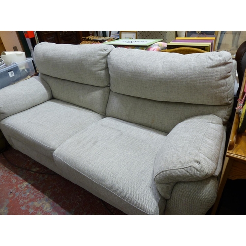 506 - An upholstered two seater settee.