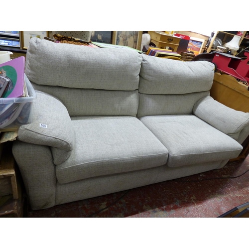 506 - An upholstered two seater settee.