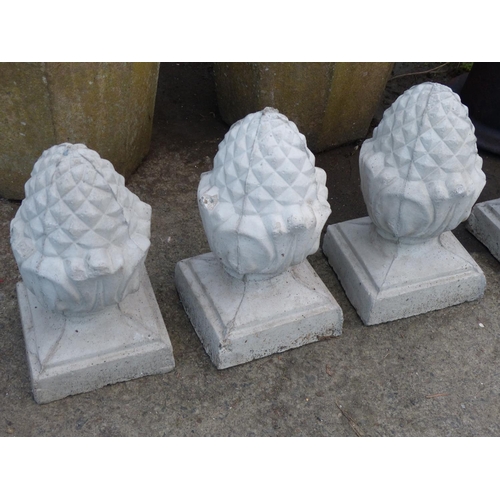 28 - A set of 5 concrete acorn pillar toppers.