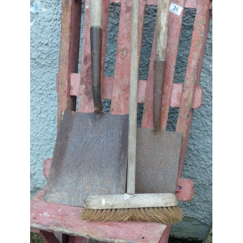 38 - An antique peat cart/wheelbarrow, two shovels and a brush.