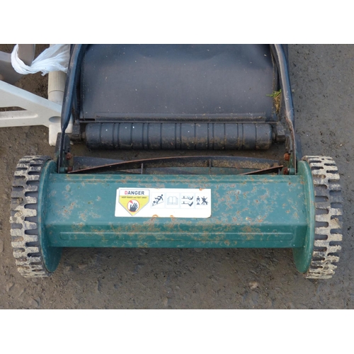 4 - A garden hose reel along with a push lawnmower.