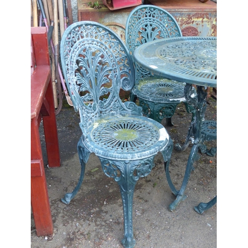 50 - A Stunning cast iron bistro garden table and four chair set.