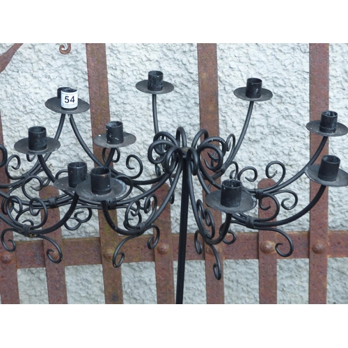 54 - A pair of 8 branch floor standing candelabras.