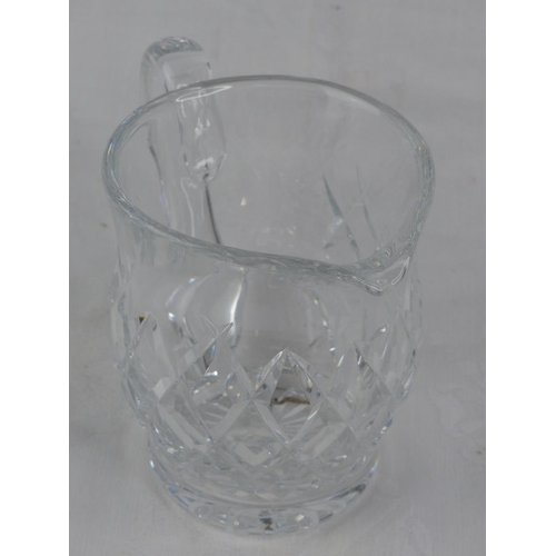 106 - A Waterford Crystal jug.