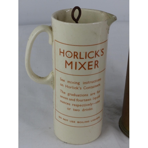 109 - An antique brass shell case and a vintage ceramic Horlick's Mixer and jug.