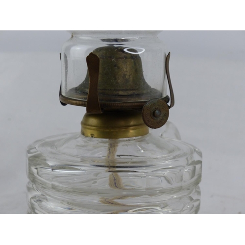 116 - A vintage clear glass finger lamp.