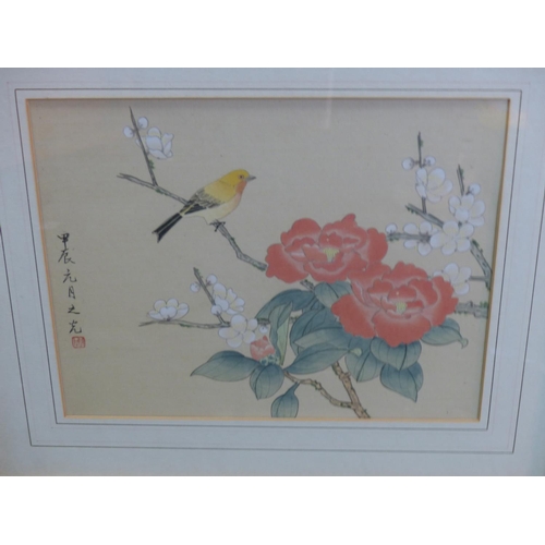 127 - A pair of Oriental framed pictures.