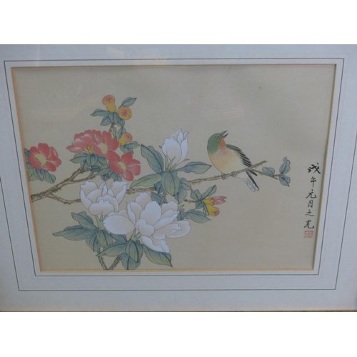 127 - A pair of Oriental framed pictures.