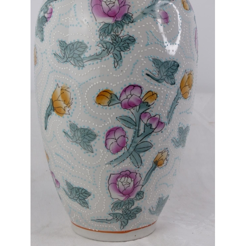 135 - A large decorative floral vase with hand painted detail.