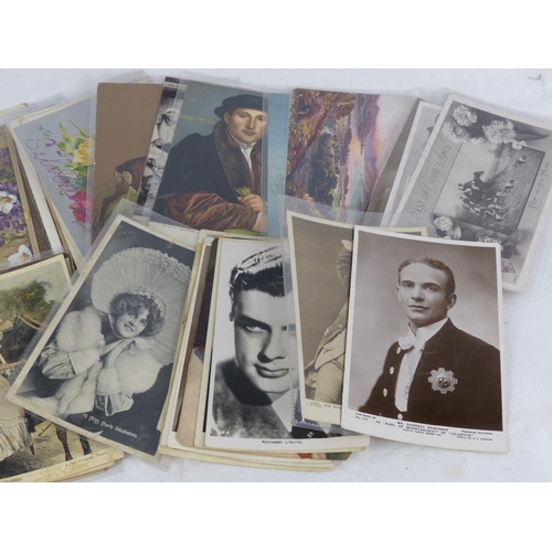 141 - A lot of antique and vintage postcards, some in presentation folders.