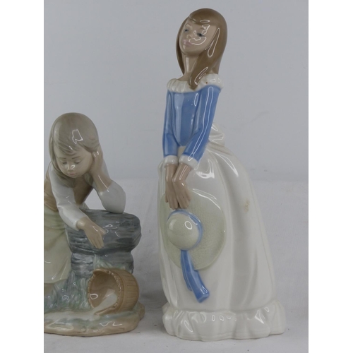 148 - Two Lladro Nao figures.