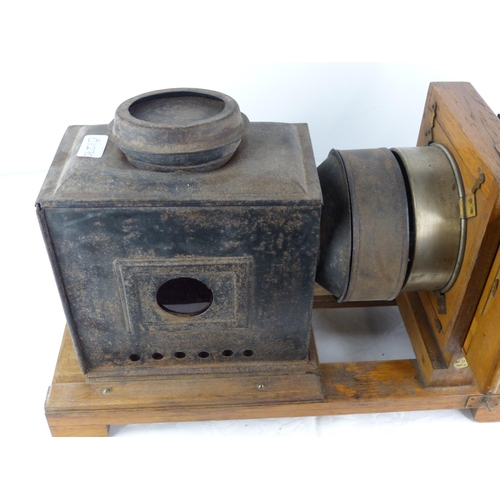 98 - An antique wooden cased magic lantern.