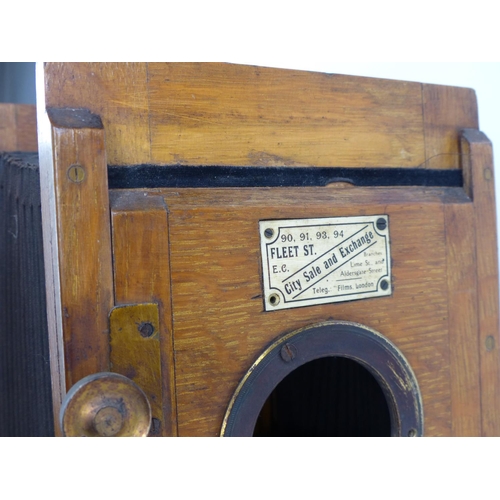 98 - An antique wooden cased magic lantern.