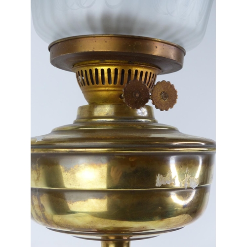 185 - A stunning antique Corinthian based oil lamp with blue glass shade.