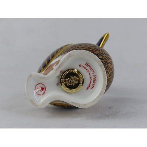 194 - A Royal Crown Derby 'Brown Pelican' paperweight, with gold stopper.