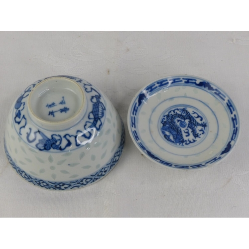 210 - A stunning decorative Chinese tea bowl and saucer, each signed to base.