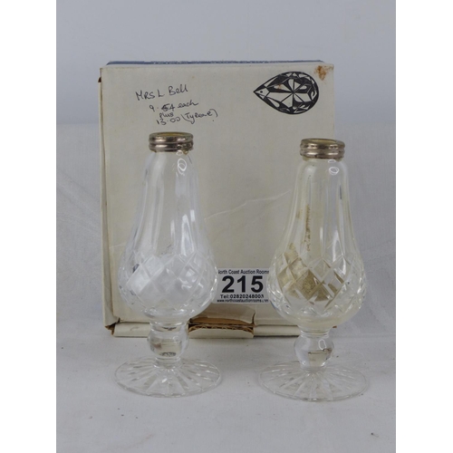 215 - A boxed pair of Waterford crystal salt and pepper shaker (lacking stoppers).