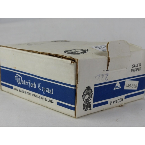 215 - A boxed pair of Waterford crystal salt and pepper shaker (lacking stoppers).