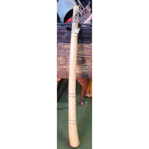 219 - A decorative wooden Didgeridoo.