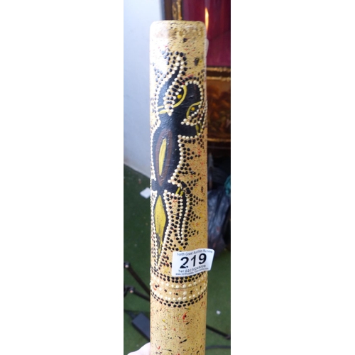 219 - A decorative wooden Didgeridoo.